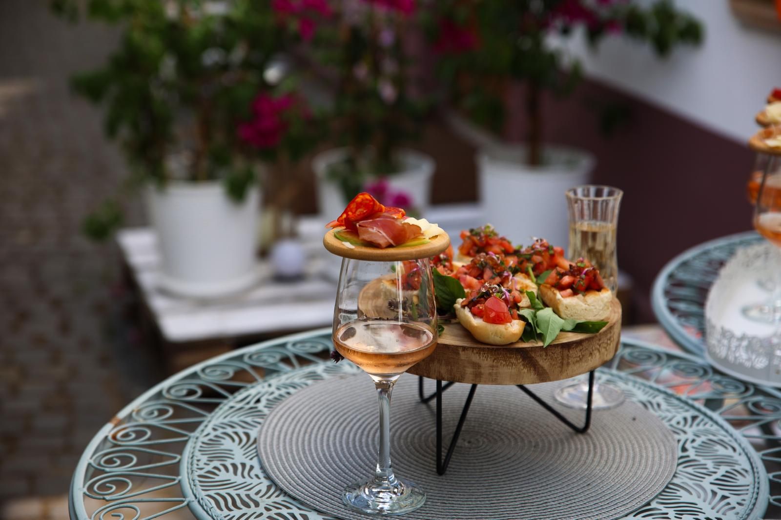 Bruschetta with tomatoes and oregano, served with a glass of wine