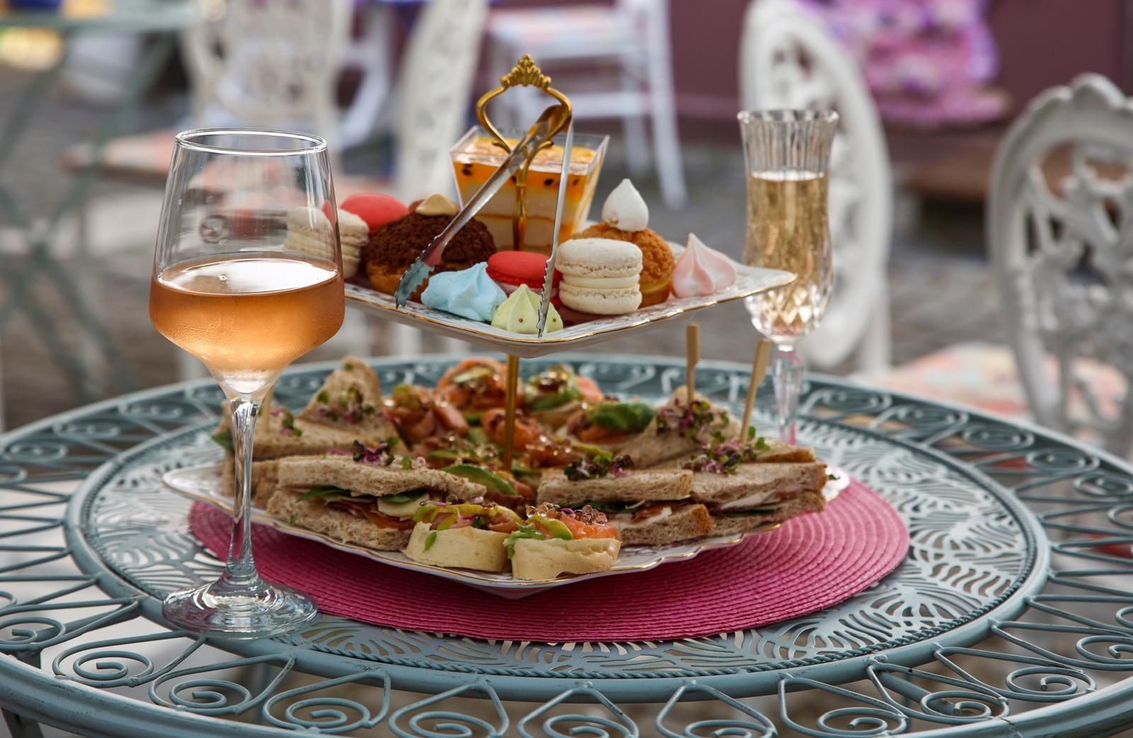 A tiered stand of sandwiches and small desserts for the High Tea ritual